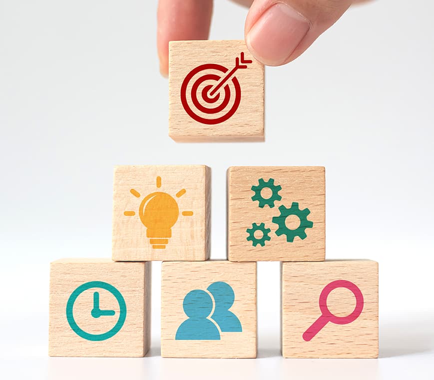 Our Vision - Wooden blocks with business icons